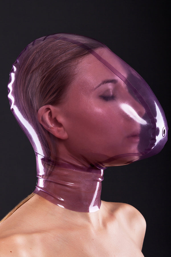 Latex ecstasy mask with a small hole for breath control
